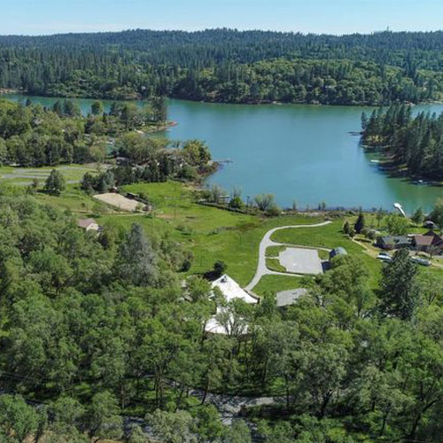 Aerial view of a lake and forested area